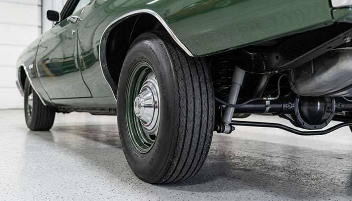 Rear wheel well of a 1968-72 Chevelle showing tire clearance to the frame rail on the inside and the quarter panel lip on the outside
