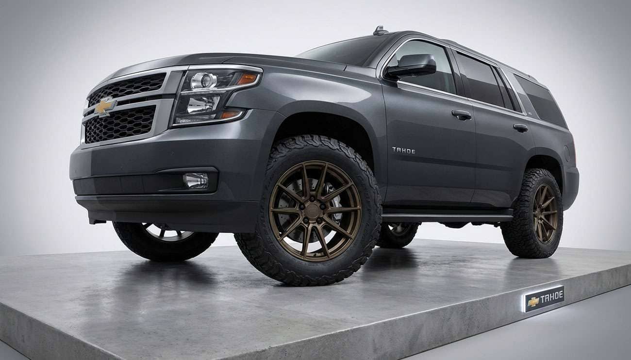 Chevrolet Tahoe with aftermarket tires and wheels showcasing perfect fitment on a professional display