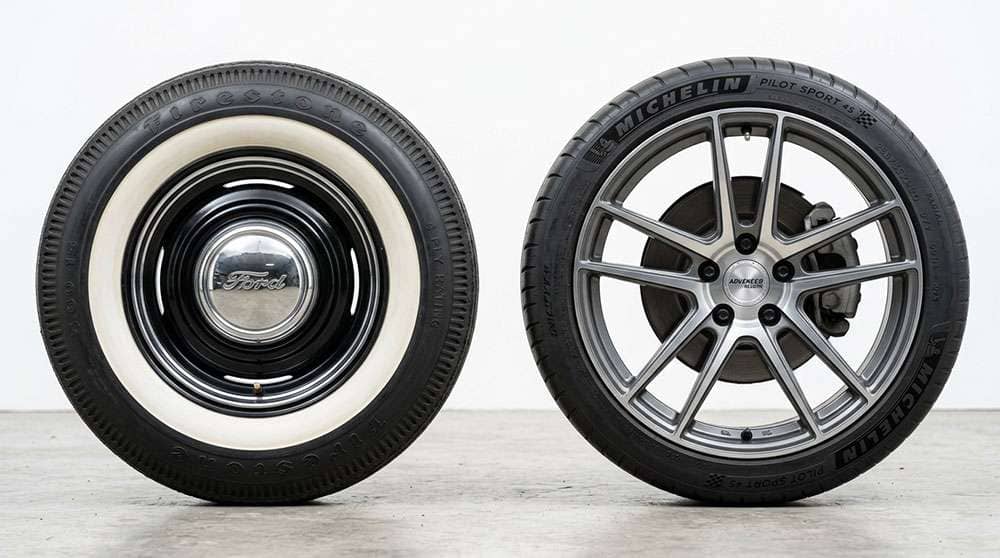 Side-by-side comparison of a classic 15 inch steel wheel with tall sidewall tire and a modern 20 inch alloy wheel with low profile tire