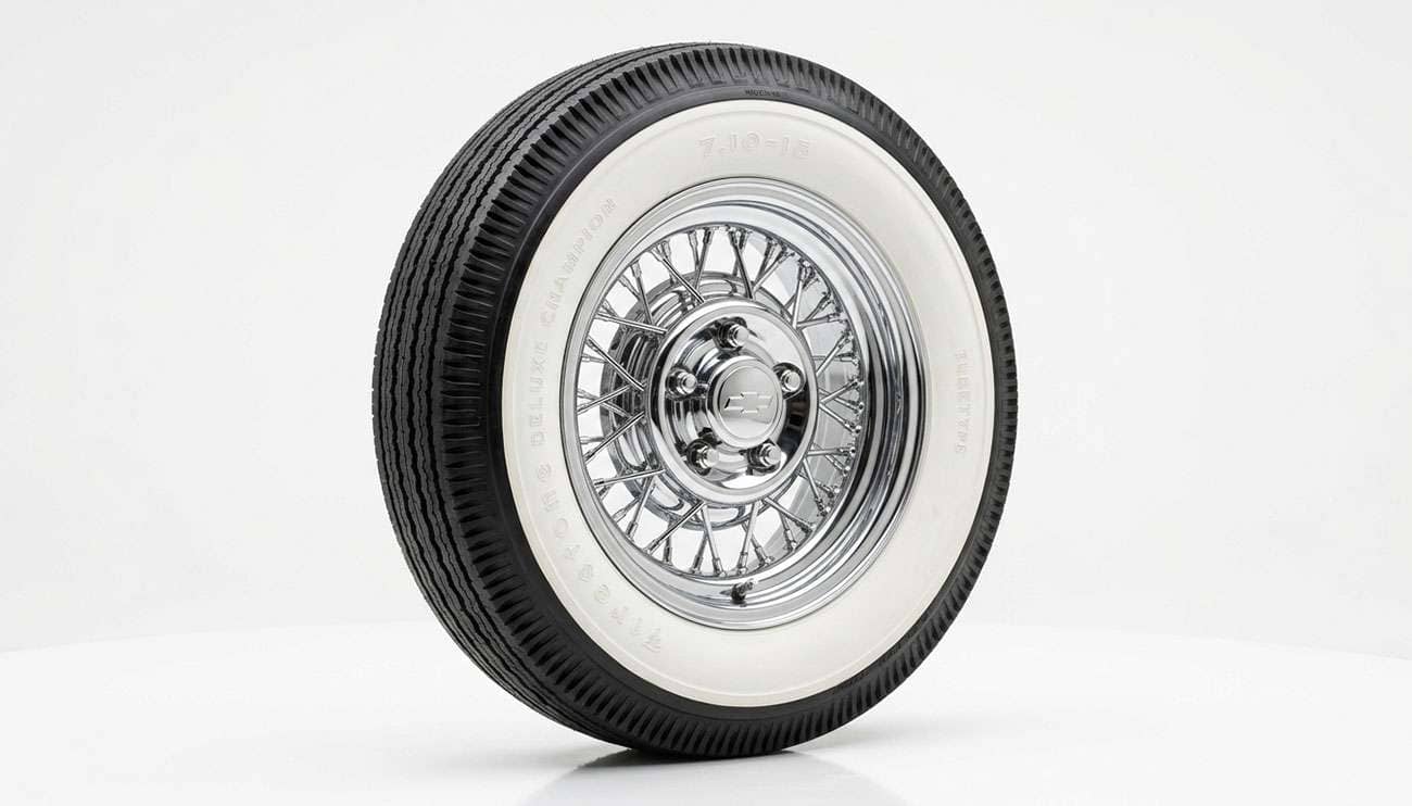 Classic car whitewall tire on a chrome wheel shown to illustrate proper tire pressure