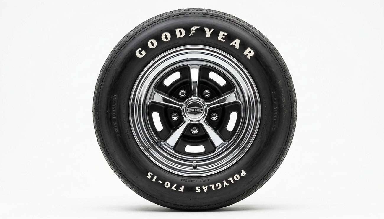 Classic Mopar muscle car wheel showing iconic styling with chrome finish and period-correct sidewall tire