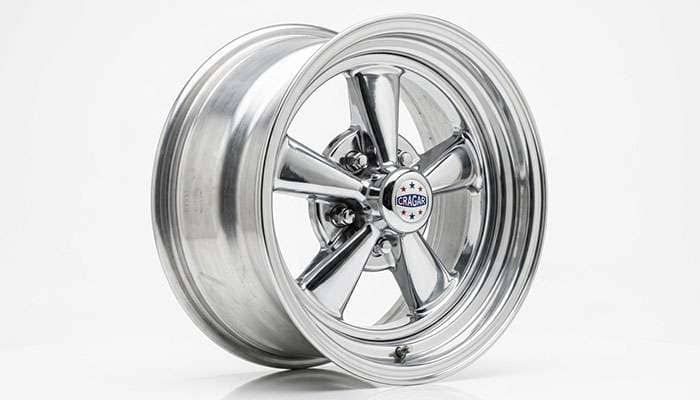 Polished aluminum Cragar five-spoke wheel, side angle
