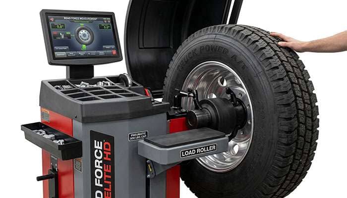 Wheel and tire assembly mounted on a road force balancing machine