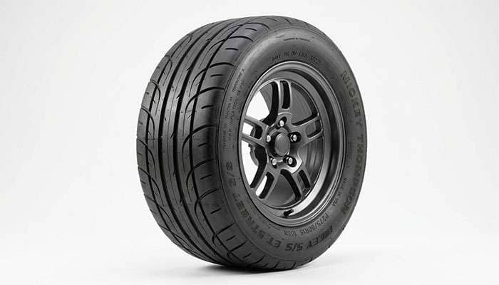 DOT-legal drag radial tire showing tread pattern and DOT sidewall marking