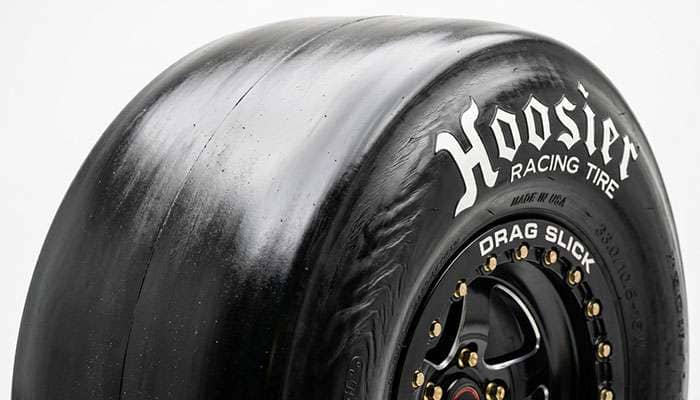 Close-up of a drag slick showing its smooth treadless surface and thin sidewall
