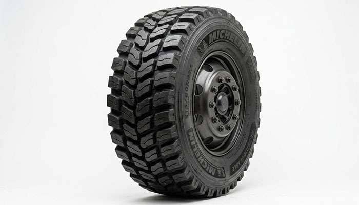 Close-up of a commercial drive tire with deep lugged tread