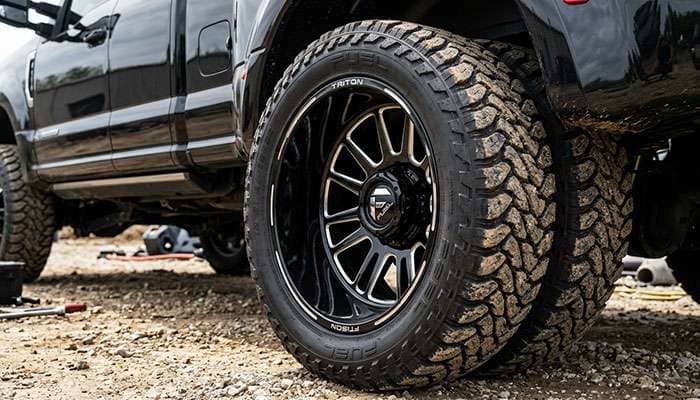Close-up of a dual rear wheel assembly fitted with Fuel Triton Dually Rear D581 wheels