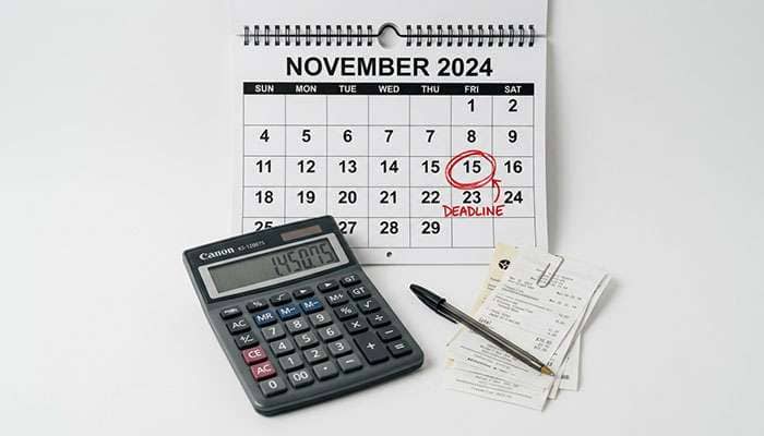 Calendar and calculator on a workbench marking an early purchase option deadline