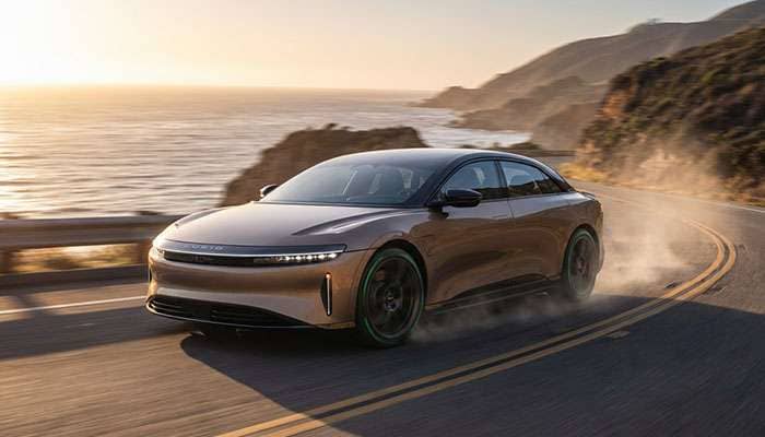 Eco-friendly tires driving on a winding coastal road demonstrating performance capabilities