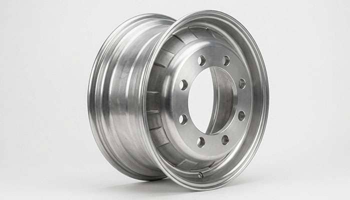 Eight-lug truck wheel shown from behind with mounting pad and backspacing measurement reference