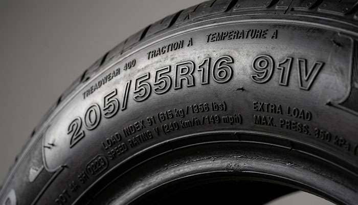 Close-up of EV tire sidewall showing HL high load designation index detail