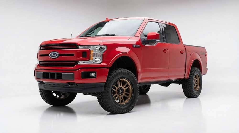 Red 2021-2026 Ford F-150 with Fuel Wheels Rebel matte bronze 22x10 wheels and 33x12.5 off-road tires