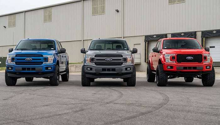 Front views of three F150 trucks showing different wheel offsets, backspacing, and tire sizes for fitment comparison