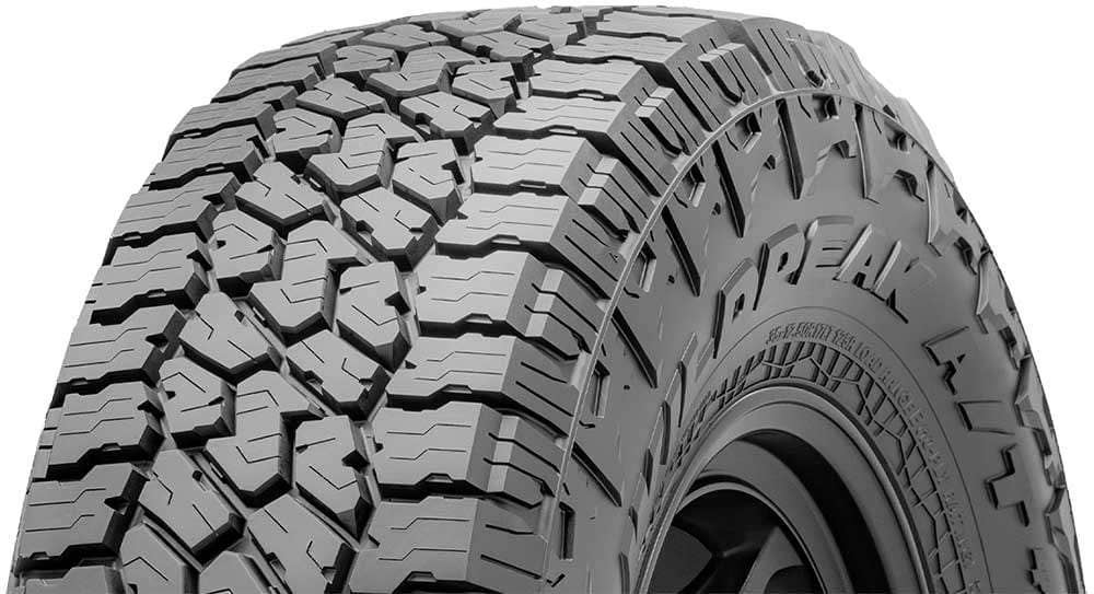 Close-up of a Falken WILDPEAK A/T4W tire showcasing its aggressive all-terrain tread pattern
