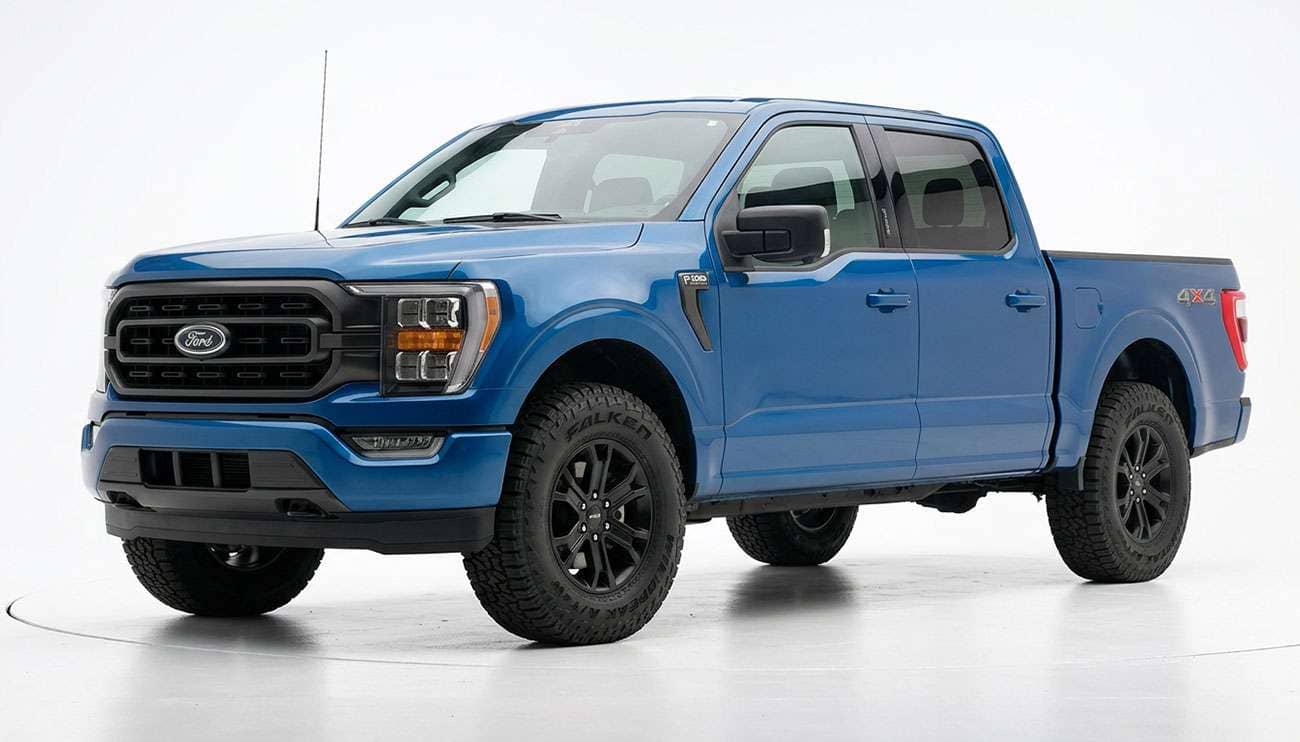 Pickup truck fitted with Falken Wildpeak A/T4W all-terrain tires parked on a gravel forest road