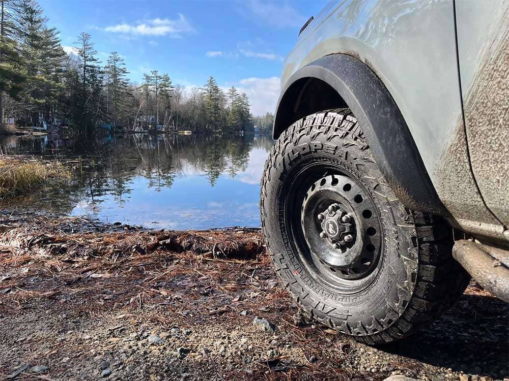 Falken Wildpeak A/T4W tire navigating rocky off-road trail showing sidewall and tread grip