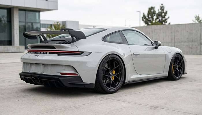 Lowered car with custom wheels showing aggressive flush or poked fitment stance