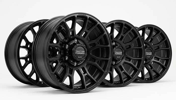 Set of forged truck wheels rated for heavy load capacity on a clean white studio backdrop