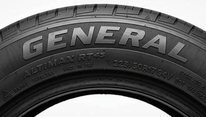 Close-up of a General AltiMAX RT45 tire sidewall showing the size, load index, and speed rating letter markings