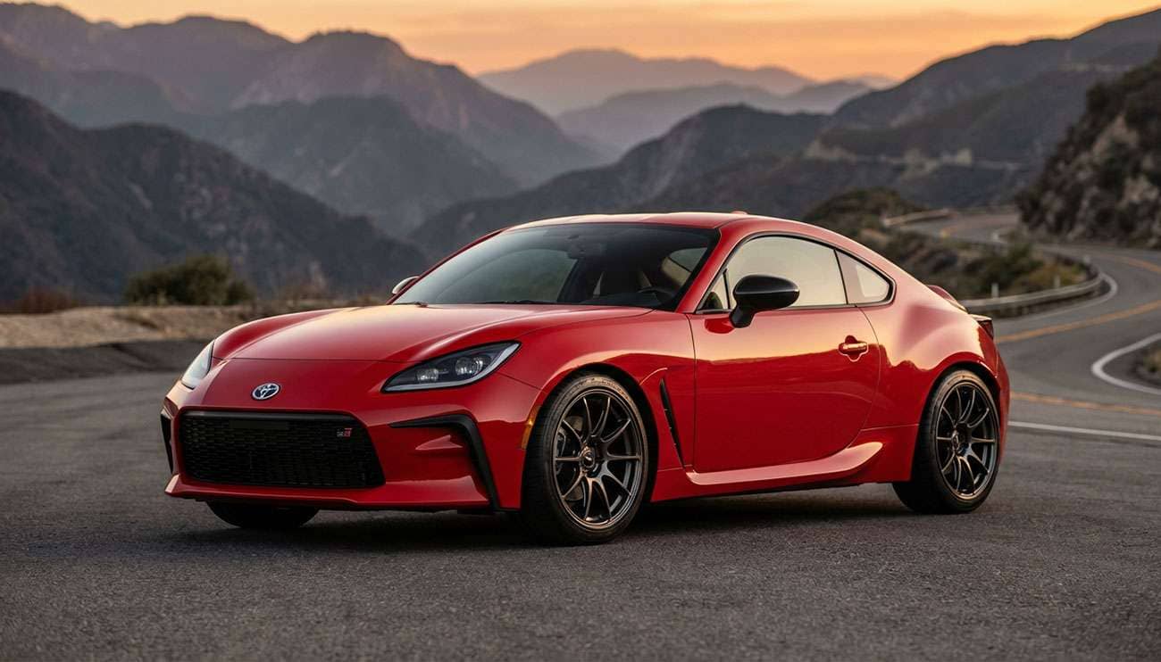 Red Toyota GR86 sports car on a winding road showcasing aftermarket wheel fitment guide