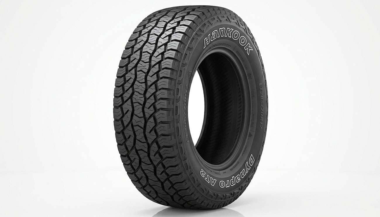 Hankook Dynapro AT2 all-terrain tire with raised HANKOOK lettering on the sidewall on a clean white seamless backdrop