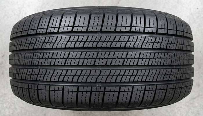 Close-up of highway terrain tire tread showing tight rib pattern designed for smooth quiet highway driving