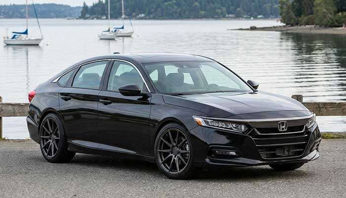 Black Honda Accord parked near water with wheel fitment specs including bolt pattern, hub bore, offset, and wheel size