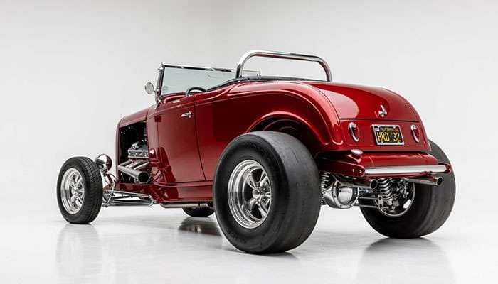 Rear three-quarter view of a hot rod showing the tall-rear raked stance