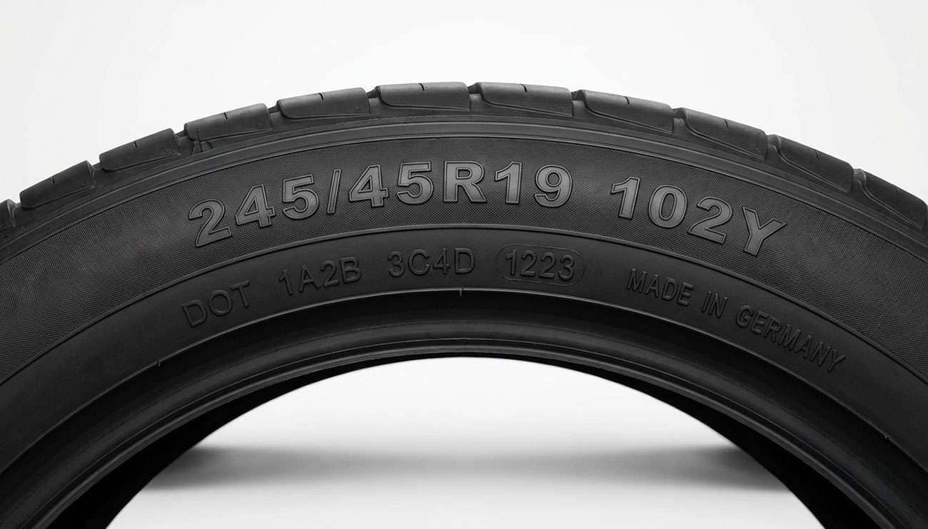 Tire sidewall markings showing speed rating, load index, and size specifications for reading tire ratings