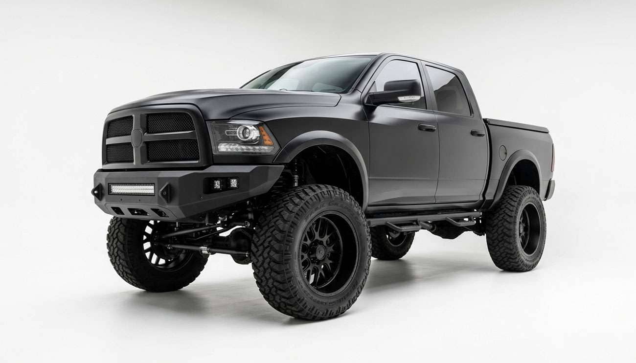 Lifted pickup truck fitted with a matched wheel and tire package showing the tire sitting proud of the fender