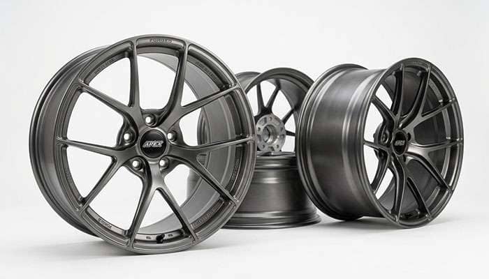 Set of lightweight forged aluminum wheels suited for performance driving on a white studio backdrop