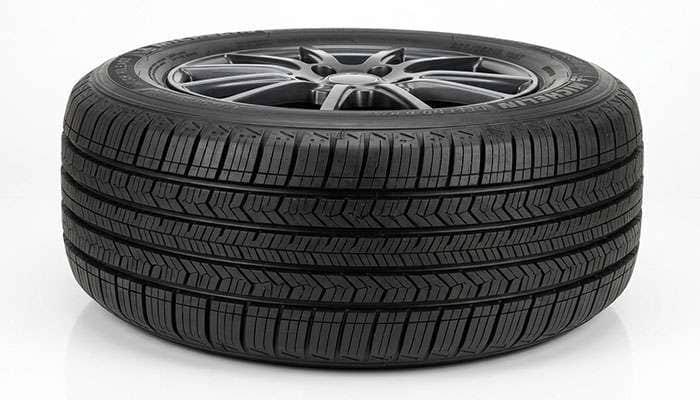 Close-up of a long-wear touring tire tread pattern designed for high mileage