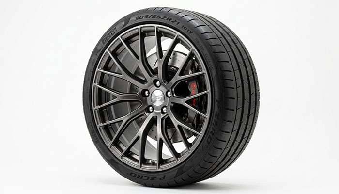 Low-profile performance tire mounted on a large-diameter alloy wheel
