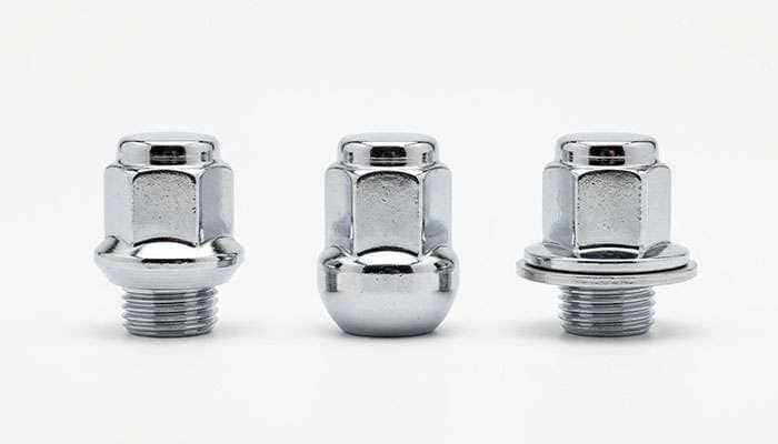 Conical, ball, and flat seat lug nuts lined up side by side for comparison