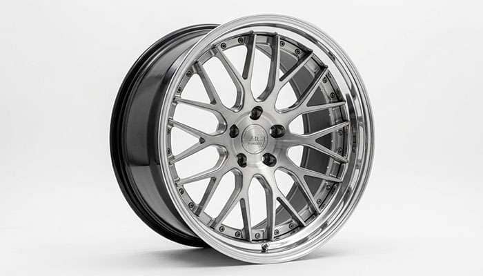 Close-up of a luxury forged multi-spoke rim with brushed and polished finish detail