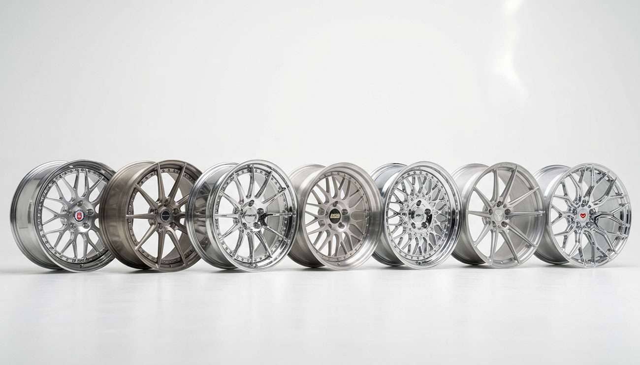 Lineup of luxury aftermarket rims with polished and brushed finishes on a white studio backdrop