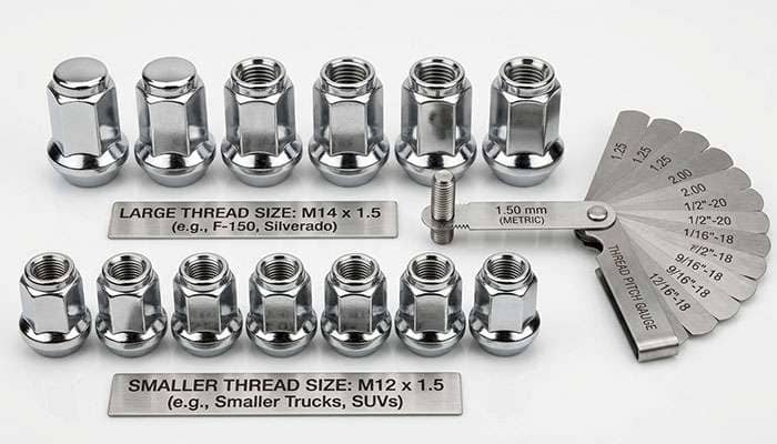 M12 and M14 cone-seat truck lug nuts side by side on a workbench next to a thread pitch gauge