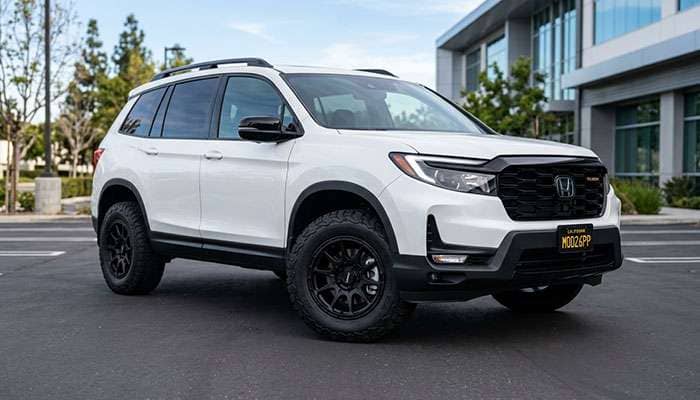 Modified 2026 Honda Passport featuring upgraded wheels and tires on a clean, white body.
