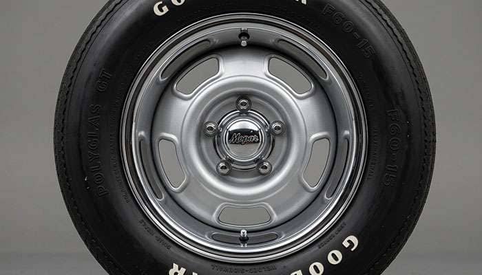 Classic Mopar Rallye wheel showing the open-spoke design with chrome trim ring and painted center