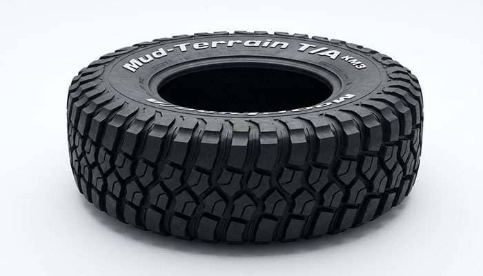 Mud terrain tire with aggressive deep tread blocks designed for off-road performance