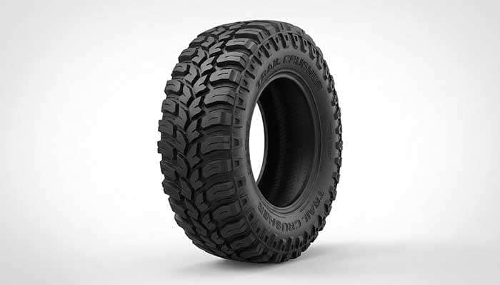 Mud-terrain tire with deep lugs and aggressive tread pattern for off-road use