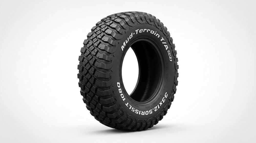 Mud tire 33X12.50R15 with aggressive tread pattern on white background