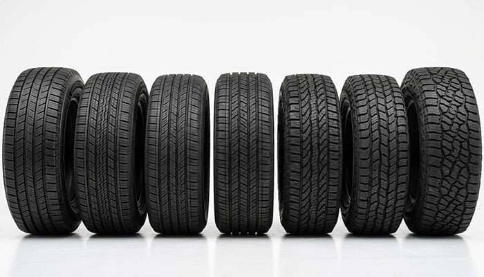 Multiple passenger and SUV tires lined up for a brand comparison