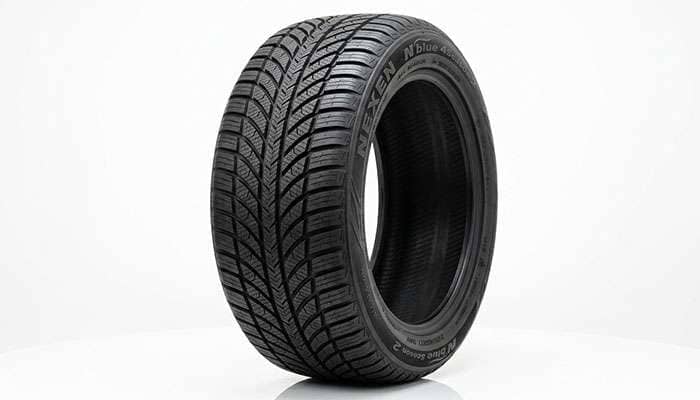 All-season tire tread pattern showing multi-angle sipes and circumferential grooves