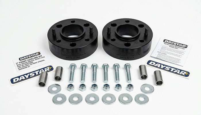Daystar 2-inch leveling kit for Nissan Armada and Infiniti QX56 including spacers, bolts, nuts, and sleeves.