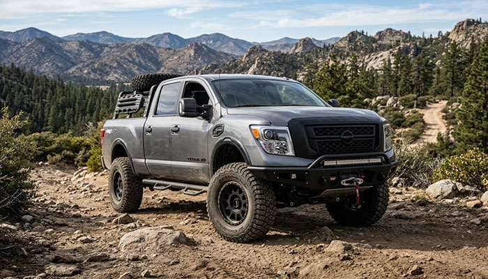 Nissan Titan XD truck equipped with upgraded 37-inch tires for enhanced off-road performance.