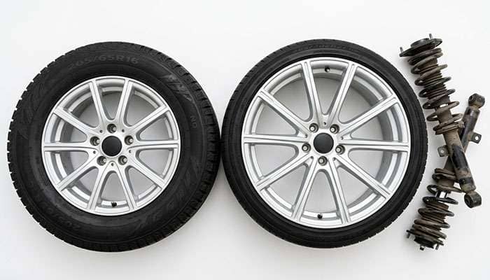 Two wheel and tire packages of different diameters shown against a plain background