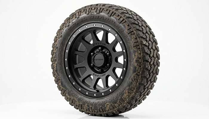 Off-road truck wheel with high load capacity rating on a clean white studio backdrop