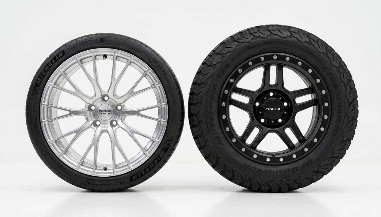 Off-road wheel and regular street wheel side by side on a clean white studio surface showing construction differences