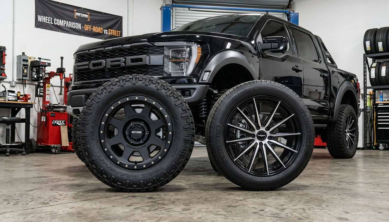 Off-road wheels with aggressive offset mounted on lifted truck next to regular street wheels showing construction differences